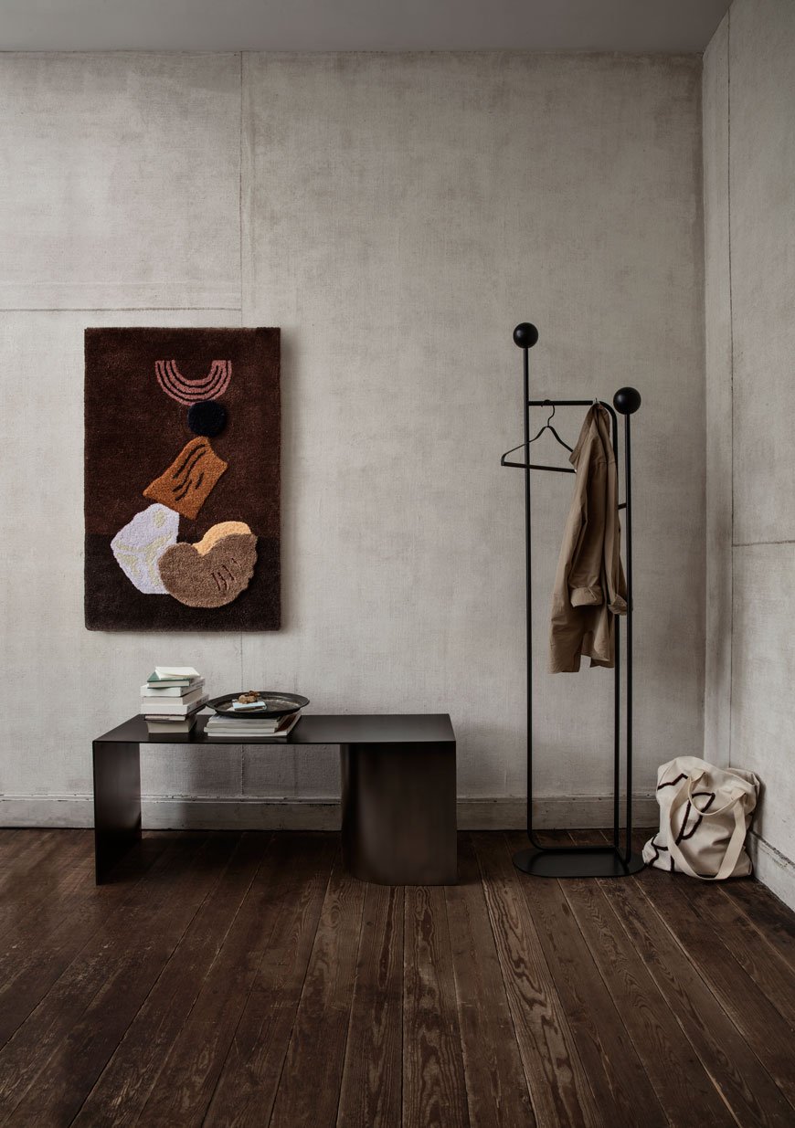 A minimalist hallway with tufted wall hanger from the Ferm Living SS 2019 catalogue.
