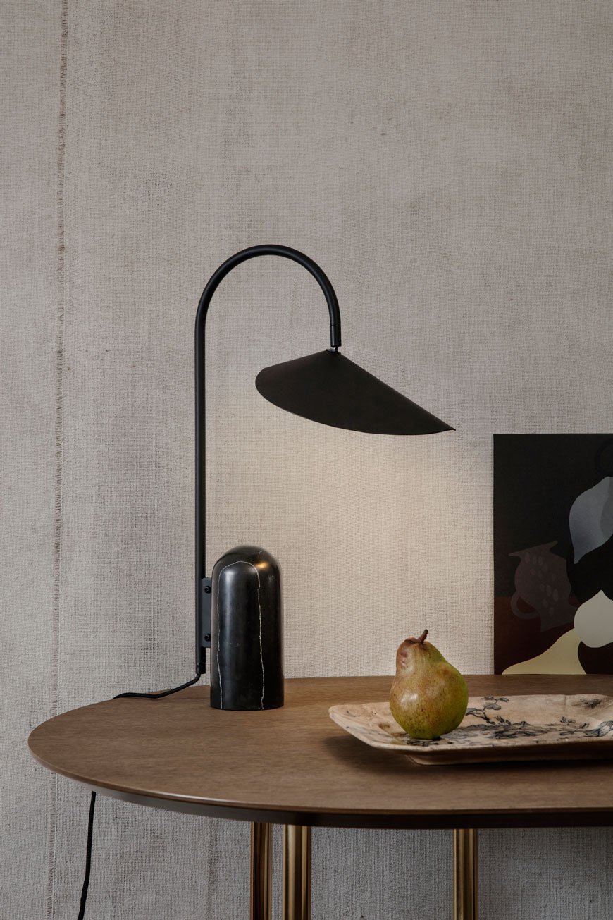 Slender black table lamp with a veined marble base, designed by Ferm Living for the SS 2019 catalogue.