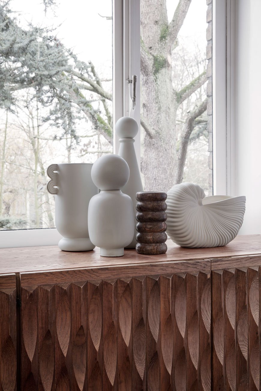 A collection of white and brown marble vases and pots in the Ferm Living SS 2019 catalogue.
