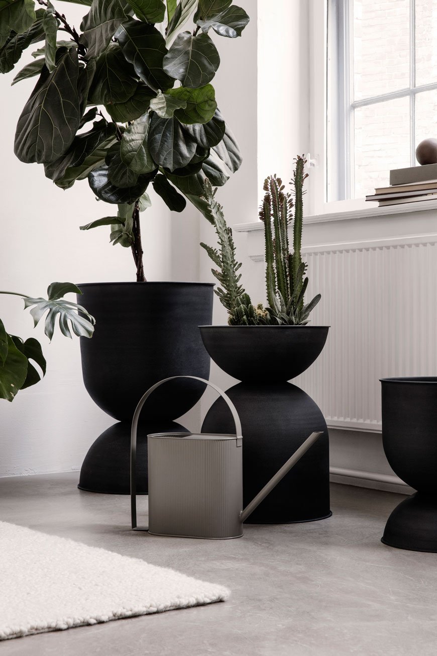 Giant black metal hourglass vases make a statement in the SS19 Ferm Living catalogue.
