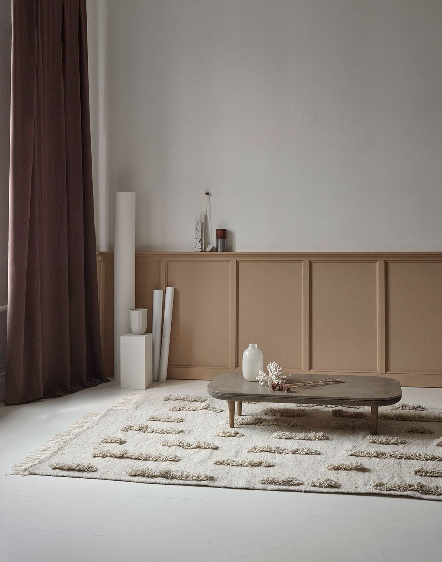 A beautifully textured wool rug designed by Sera Helsinki styled in a Scandinavian living room. 