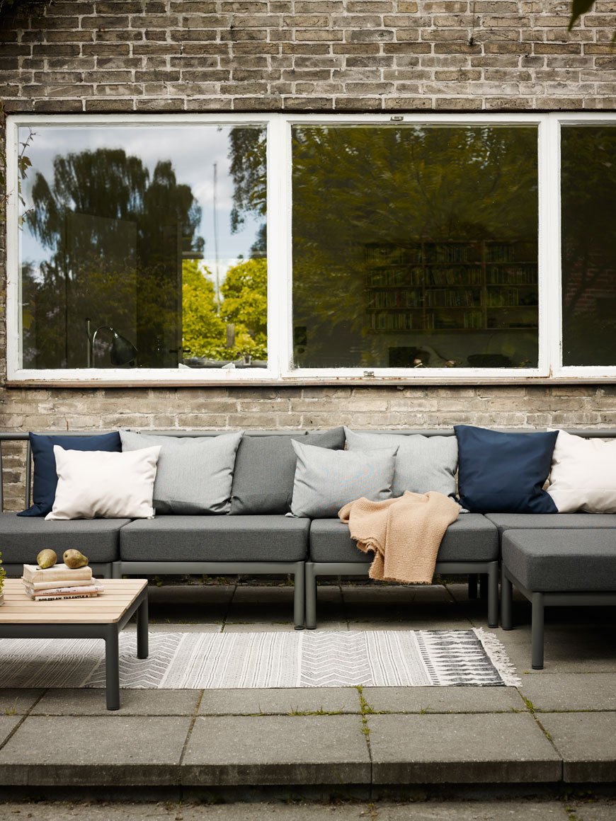 A grey modular sofa is a great option for outdoor furniture if you're having large gatherings.