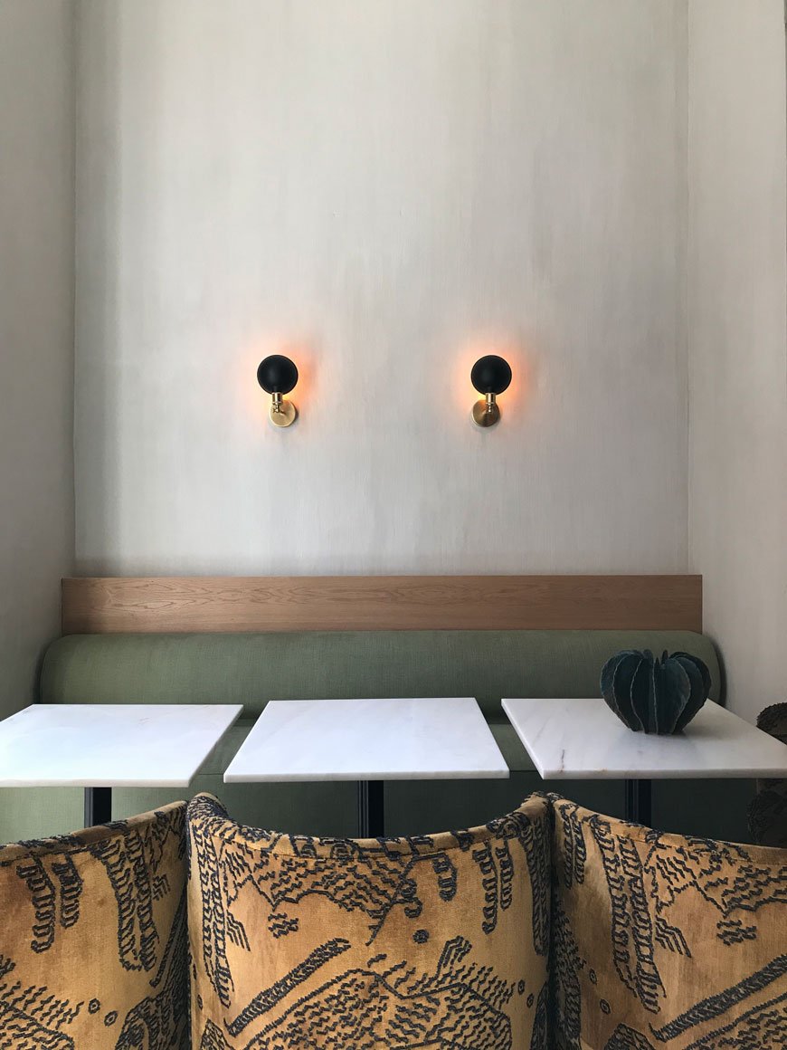 Textured pale plaster walls provide a minimal, Scandinavian backdrop for sumptous velvet Tearoom chairs by MENU inside the new restaurant at The Audo. 