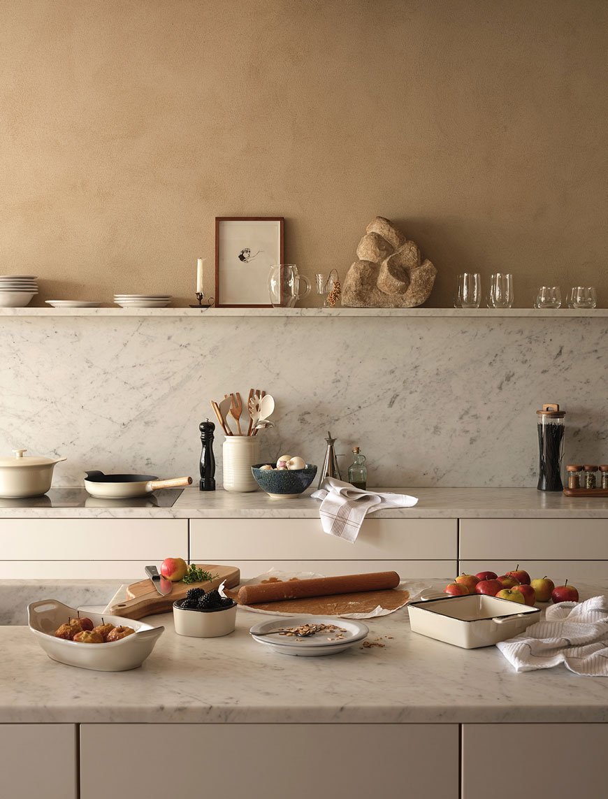 Warm honey spice lime painted walls and marble countertops create a lived-in look for the Zara Home Autumn-Winter collection. 