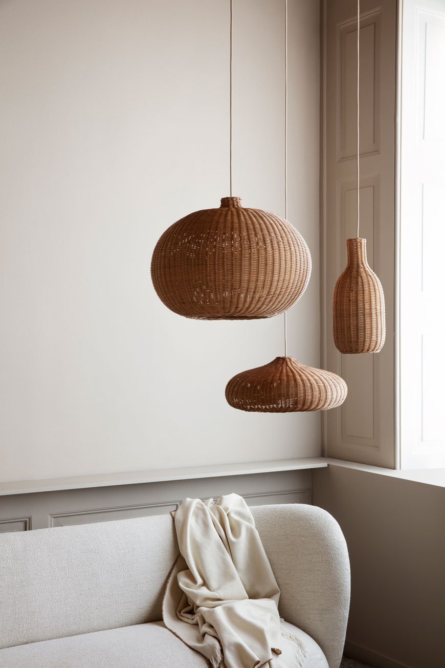 Ferm Living Braided Belly light shades hang in a neutral and minimal living space. 