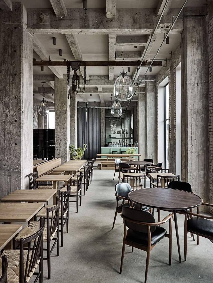 Restaurant 108, the sister site to NOMA, designed by Space Copenhagen within an industrial concrete shell warehouse. 
