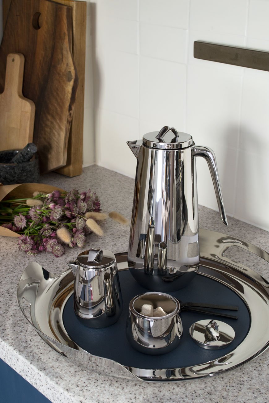 The Helix collection, a new stainless steel tea and coffee service looks at home in a blue and white Scandi kitchen.