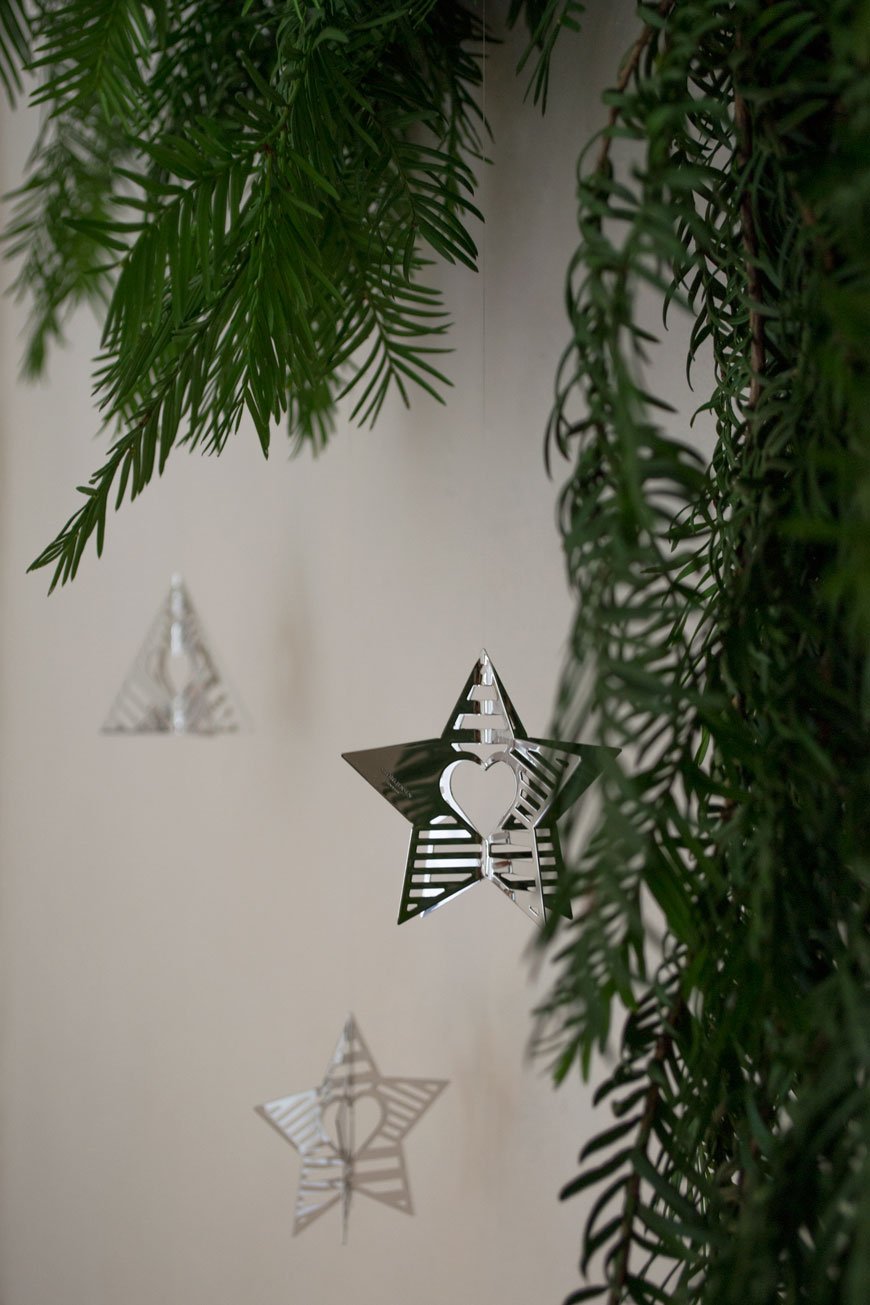 A close up of the Palladium plated Star and Tree ornaments from the Georg Jensen Christmas Collectibles collection 2019 