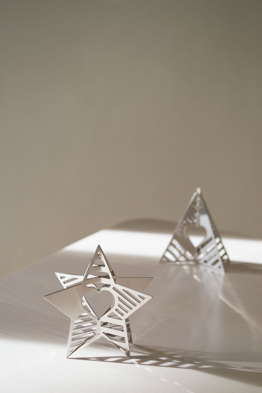 The Star and Tree ornaments from the Georg Jensen Christmas Collectibles throwing strong patterned shadows in the winter sun.