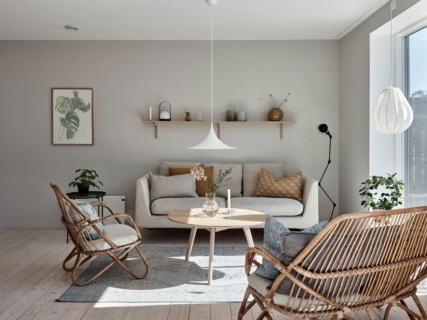 A light grey living room in an architect designed family home on the Swedish island of Brännö.