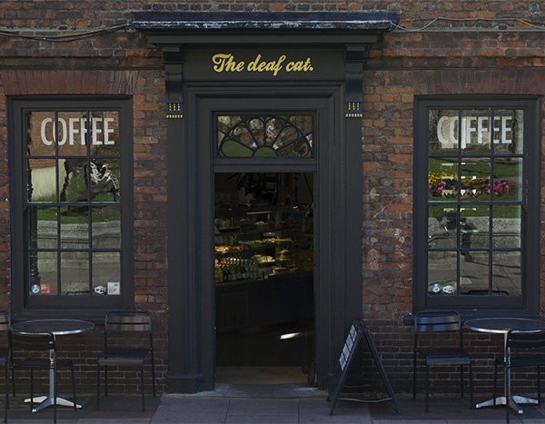 The exterior of Deaf Cat Coffee House on Rochester's historic high street