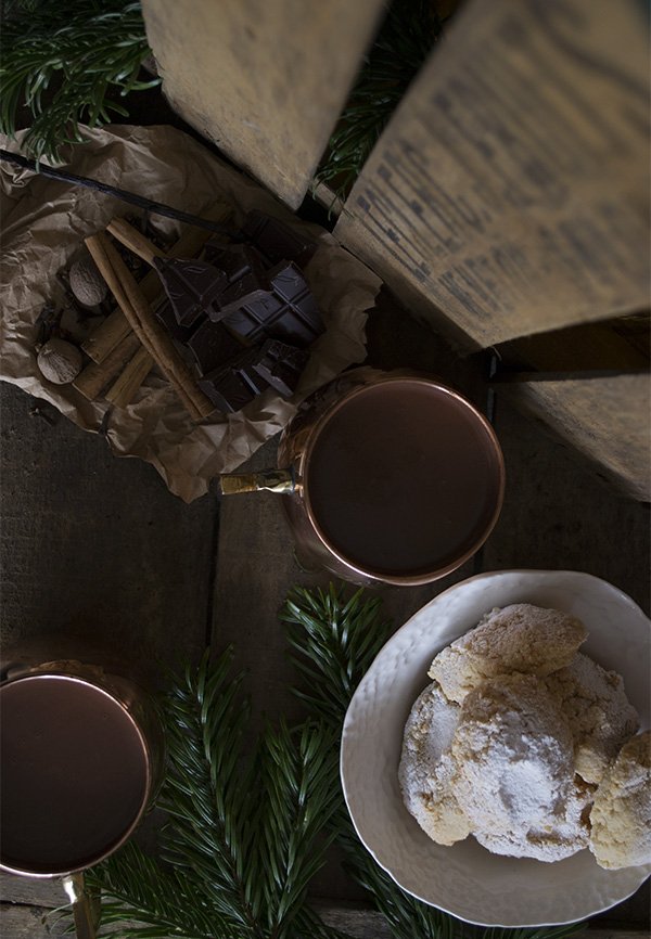 copper mugs from Mia Fleur, filled with my spiced hot chocolate recipe and accompanied by Italian ricciarelli biscuits 