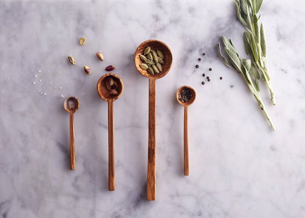 Hand-carved wooden measuring spoons by Minor Goods, an independent, understated homeware shop selling handcrafted accessories for the kitchen and home,.