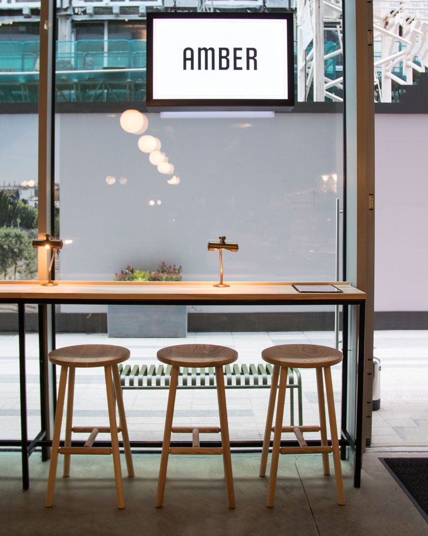London restaurant Amber in Aldgate East, contemporary modern design, ash dining furniture designed by Charles Dedman, bare plaster walls, hanging plants