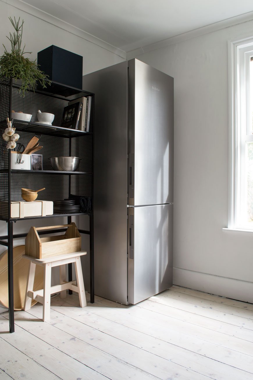 stainless steel fridge freezer, Miele appliances, black wire unit, freestanding kitchen unit, whitewashed floors, Nordic kitchen