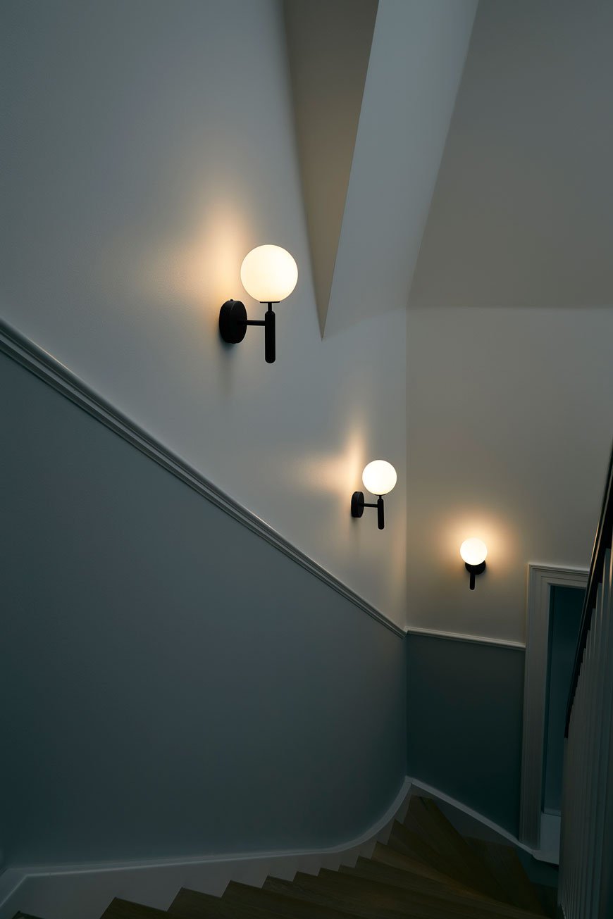 Miira Opal black wall lights in the hallway of a period property 