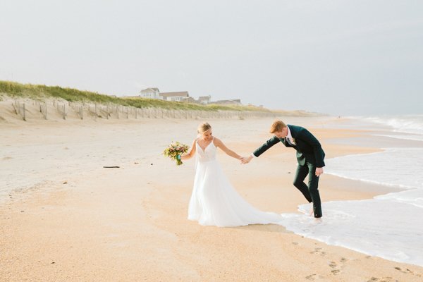 bride and groom beach walking 