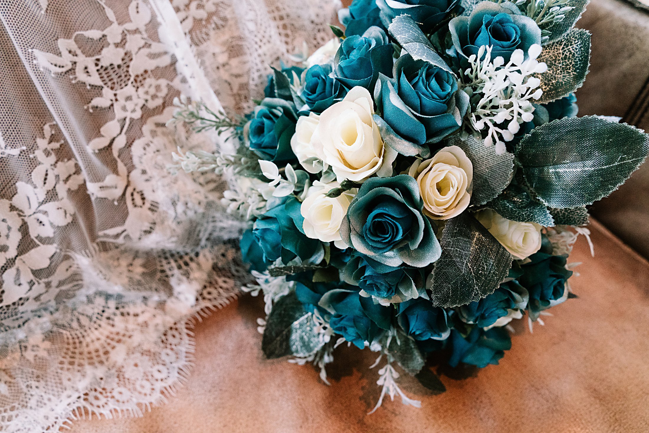 Teal flowers and lace wedding dress
