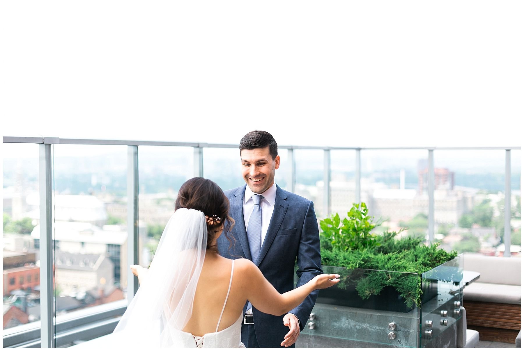 bride and groom first look at The Andaz rooftop Copper Spirits and Sights lounge 