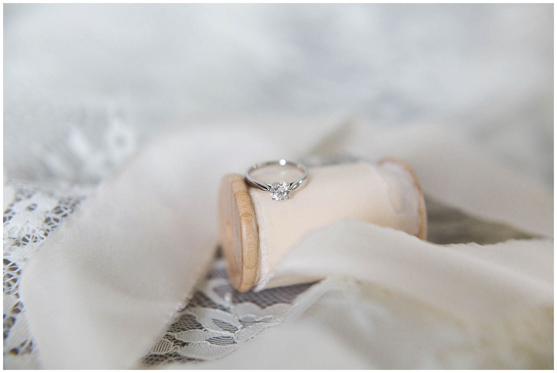 Bridal details. Engagement ring on ribbon
