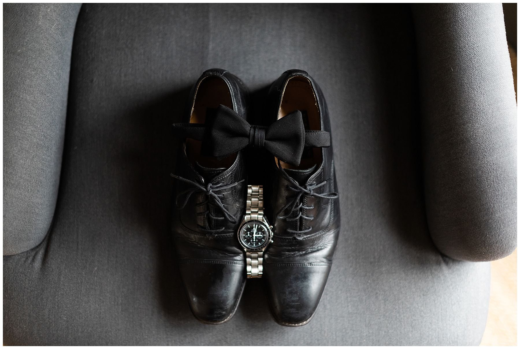 Groom detail shots of dress shoes, bow tie and watch