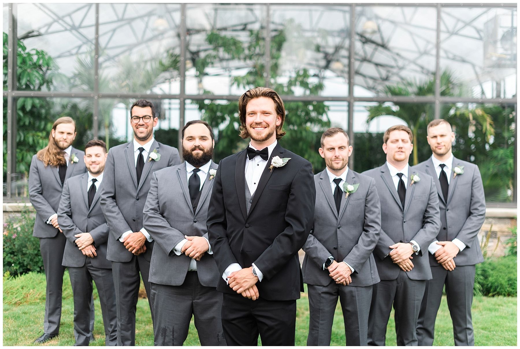 groom and groomsmen in black tux
