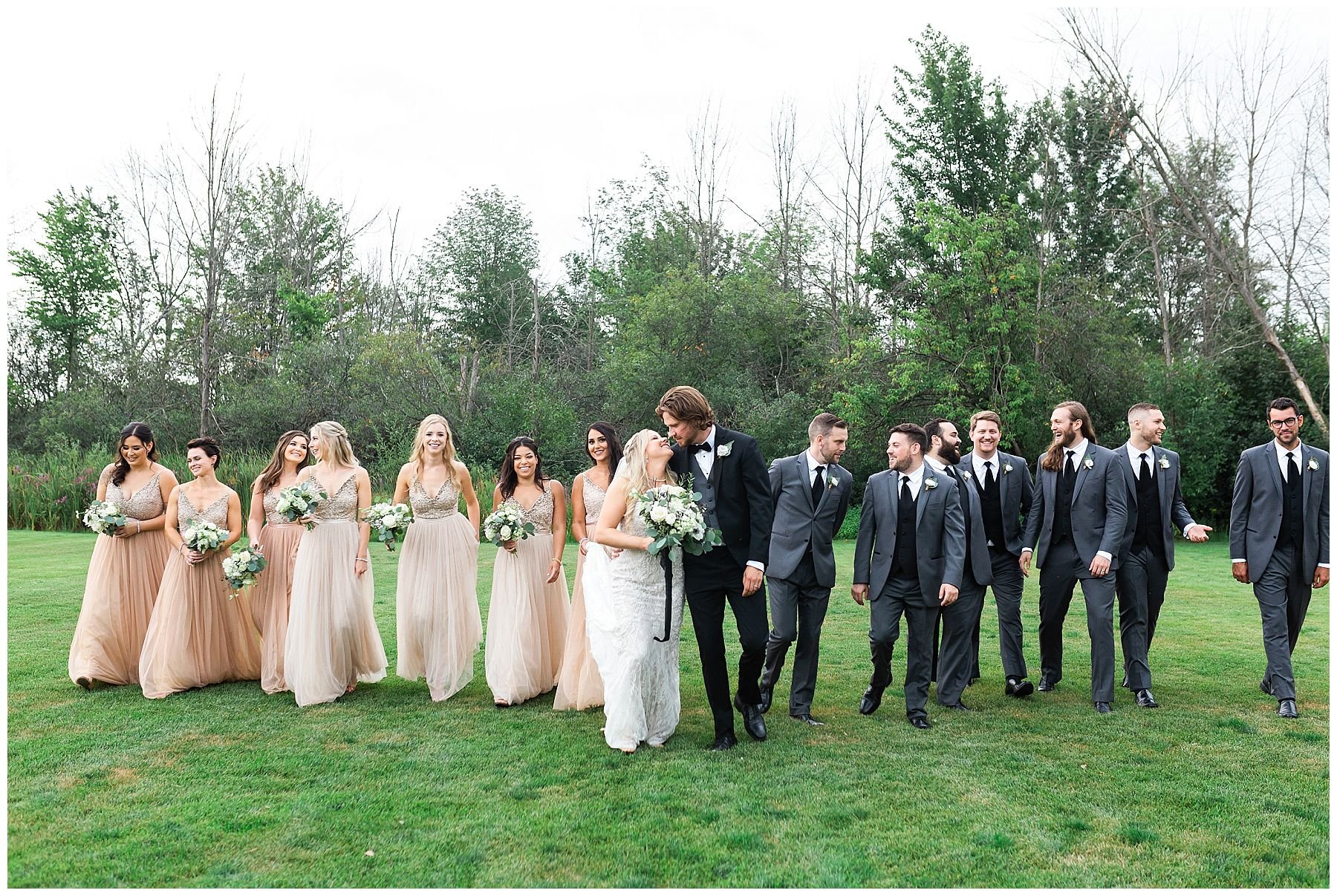 rose gold dresses and black tux bridal party
