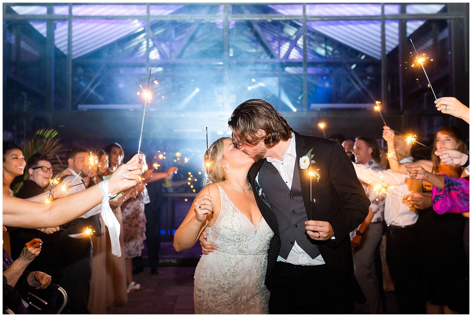 Bride and groom sparkler exit at Aquatopia conservatory wedding
