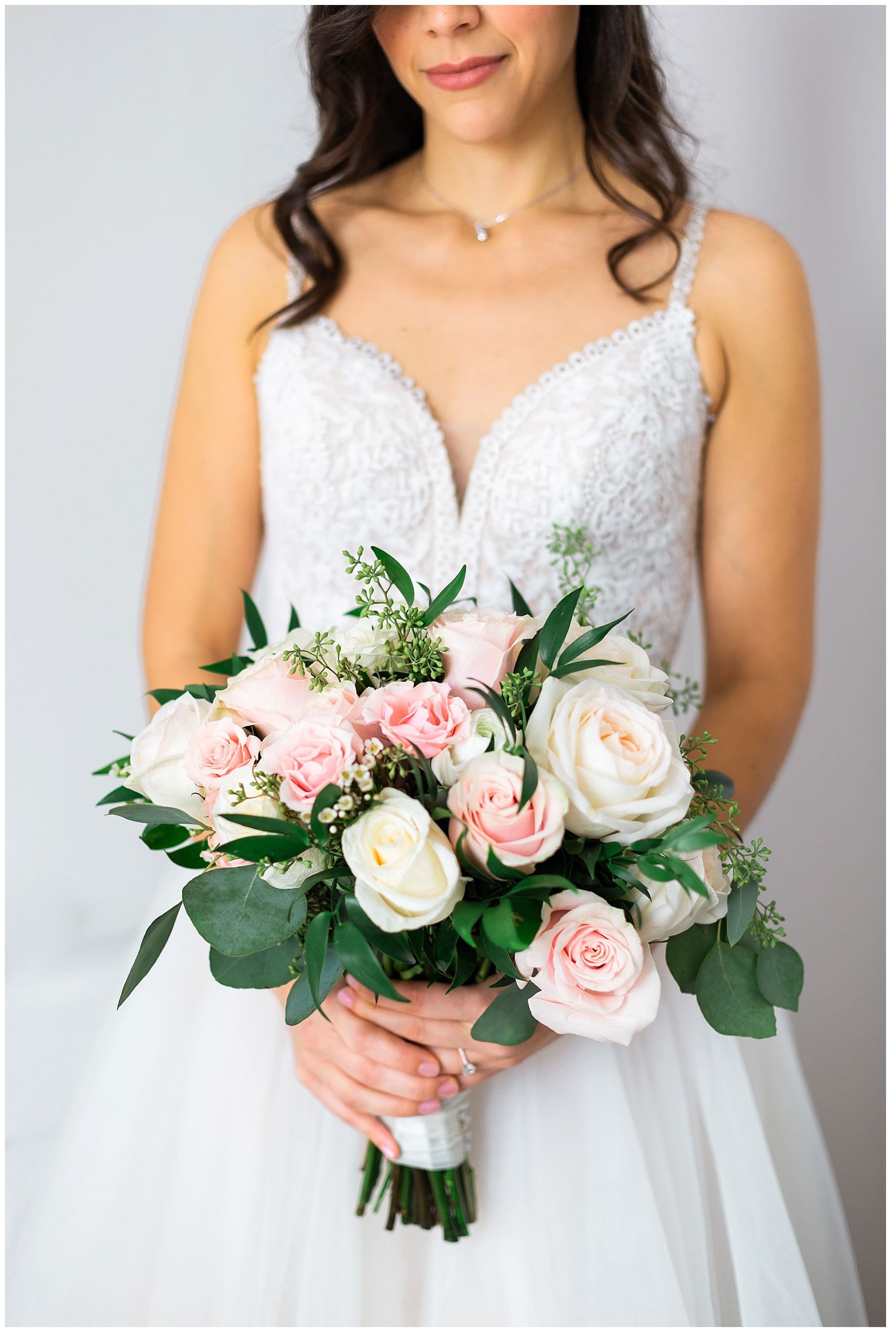 Italian bride holding her bouquet of roses