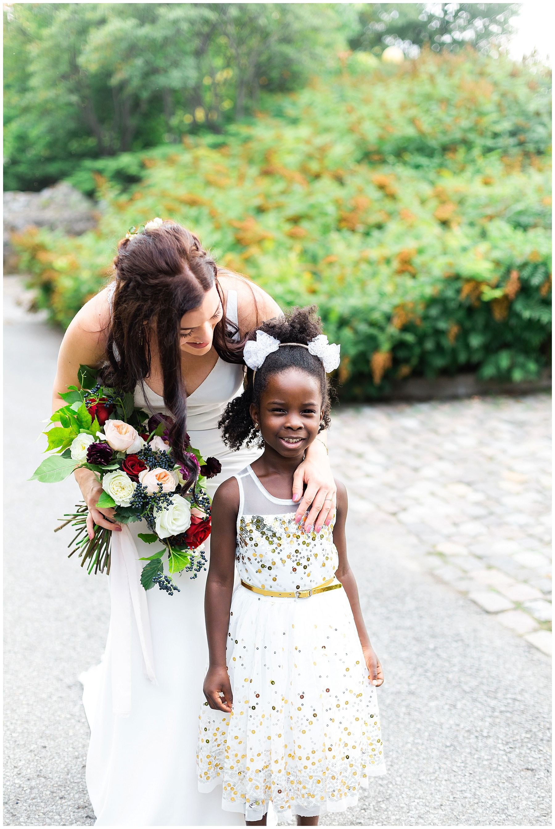 cute flower girl with gold and white dress