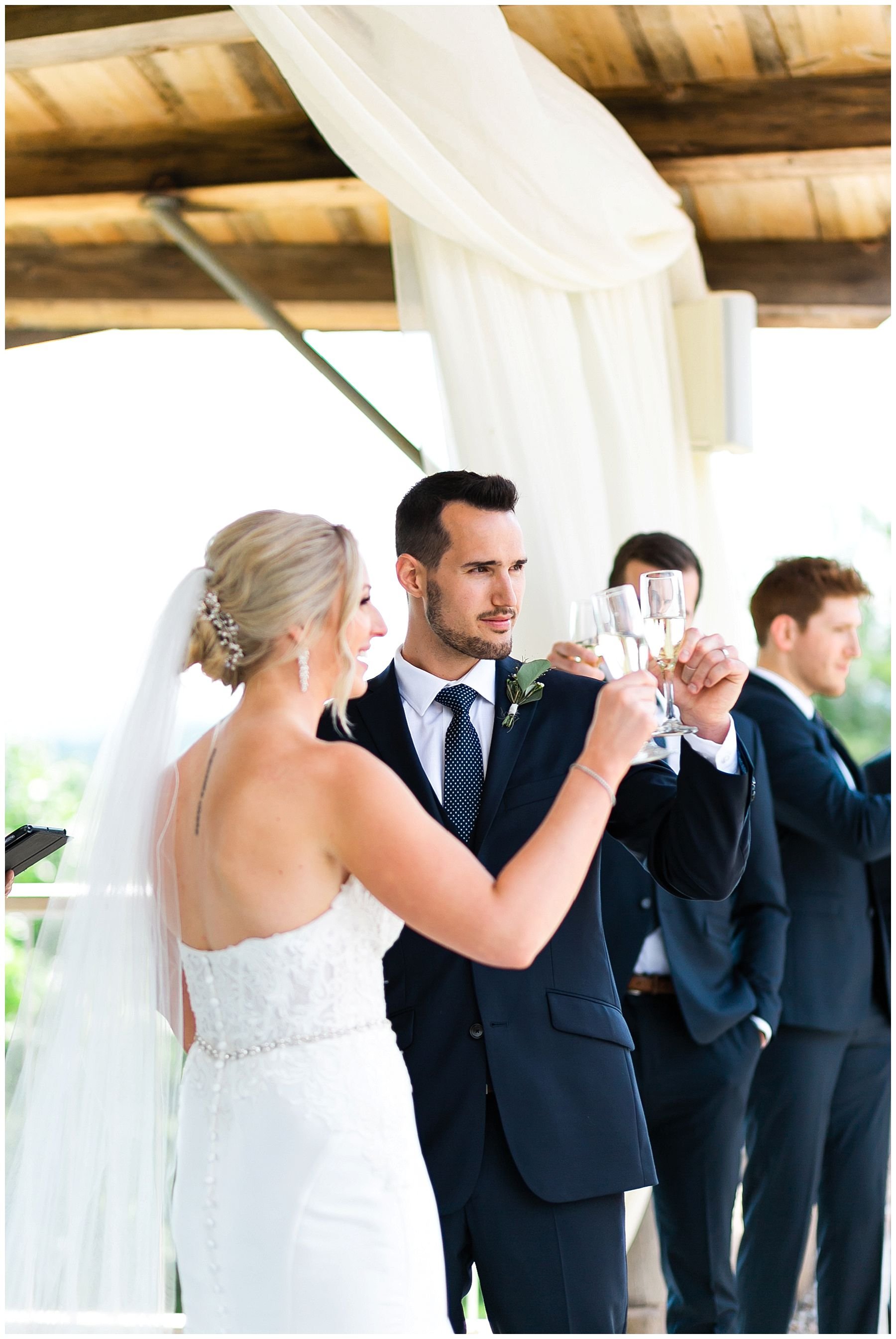 Bride and groom champagne toast during ceremony 