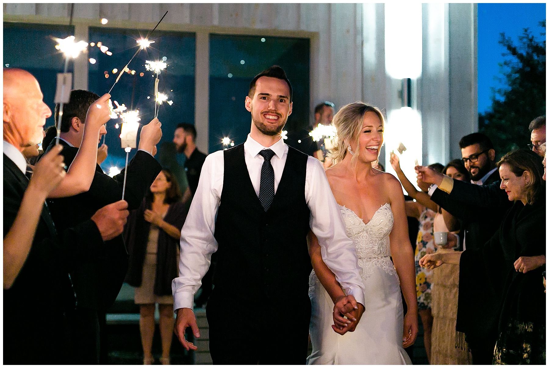 Bride and groom sparkler exit at Le Belvedere wedding in summer 