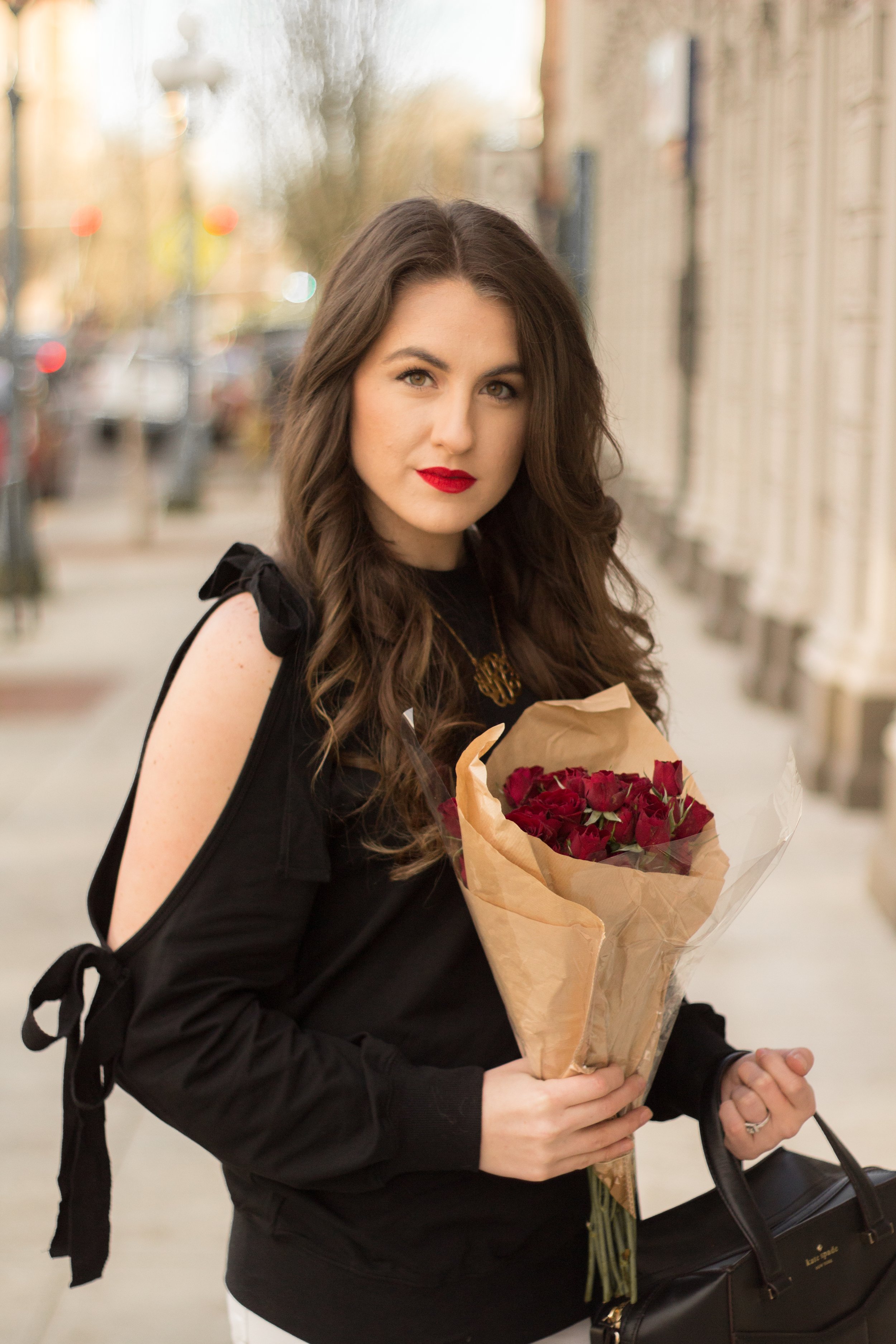 The perfect subtle Valentine's Day look with bows on your sleeves and red roses.
