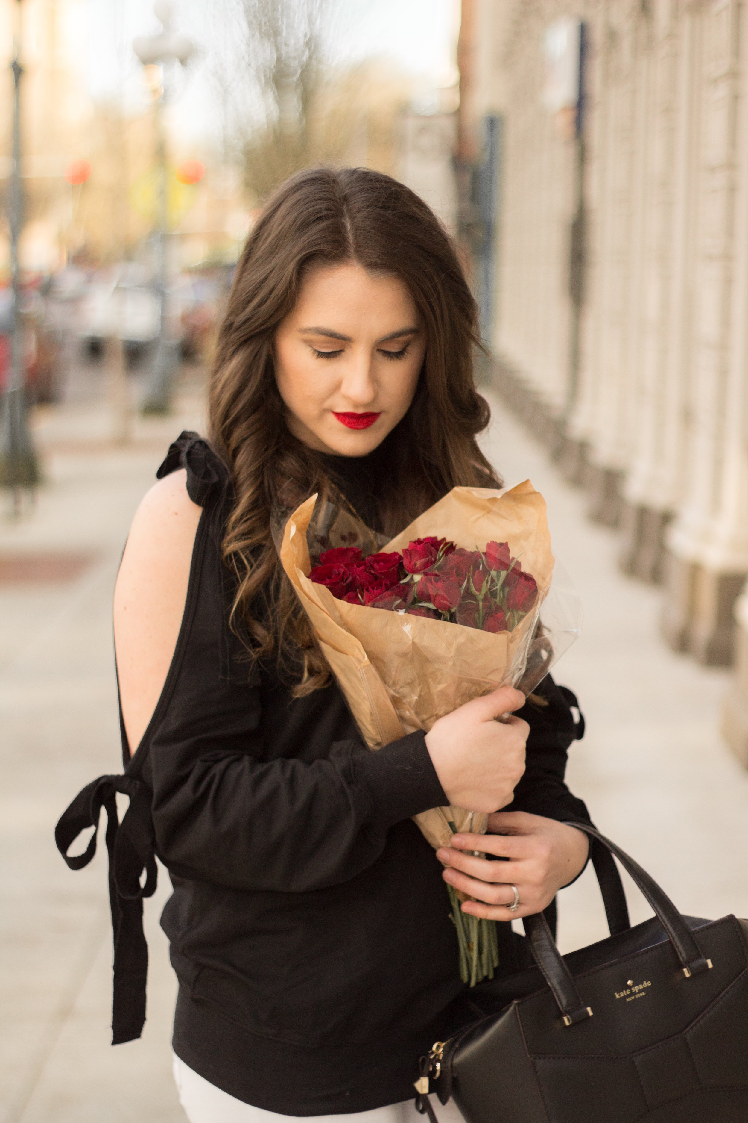 The perfect subtle Valentine's Day look with bows on your sleeves and red roses.