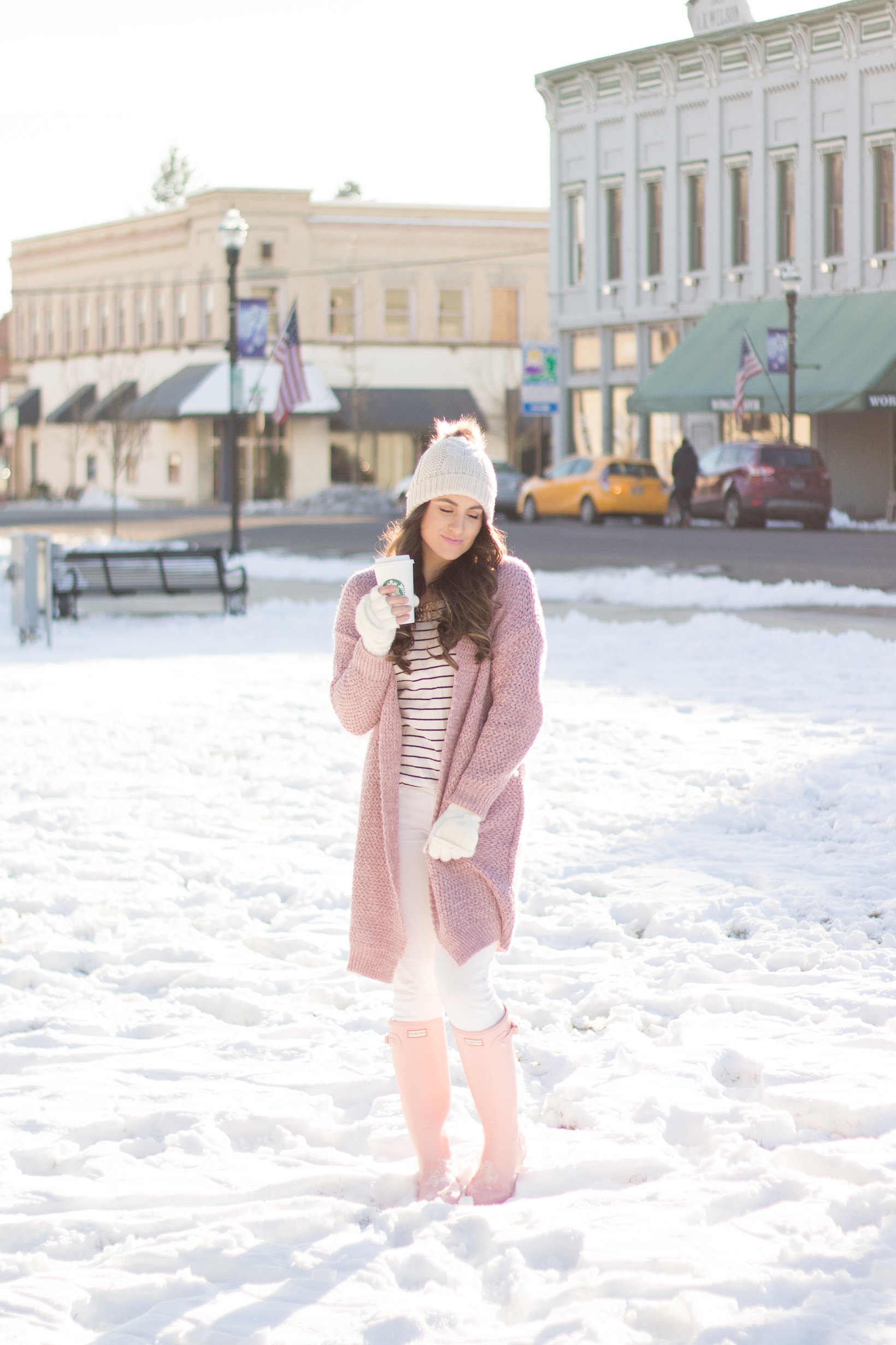 A fun pink knit sweater and pink hunter boots are the perfect equation for a snow bunny look. 