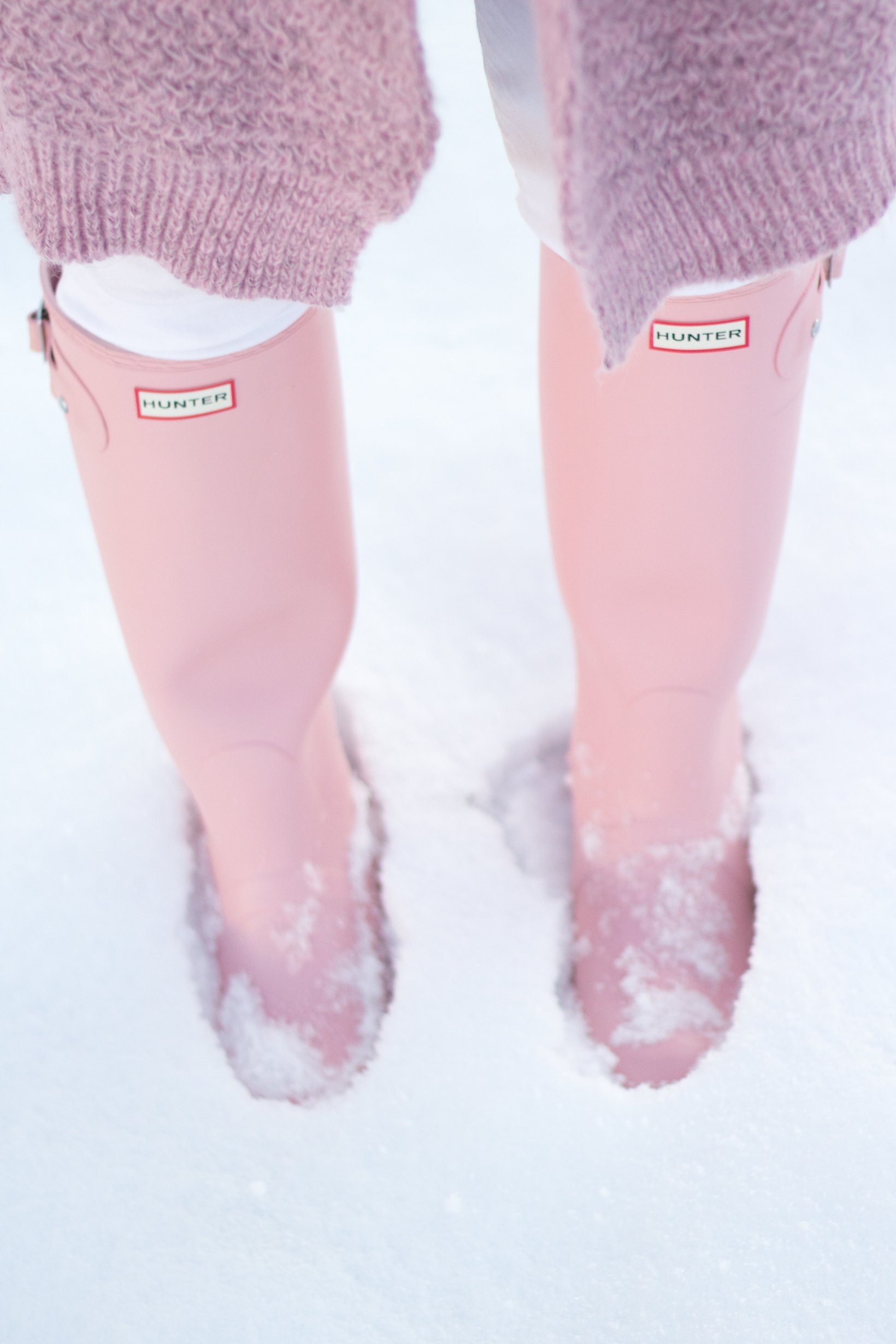A fun pink knit sweater and pink hunter boots are the perfect equation for a snow bunny look. - Are Pink Hunter Boots Worth the Money? by Portland fashion blogger Top Knots and Pearls