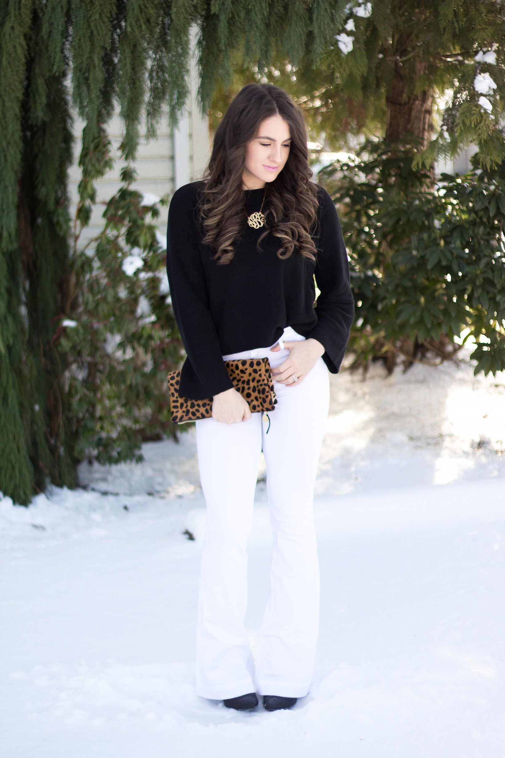 Winter white flares with black flared sleeve sweater for styling flares with confidence.