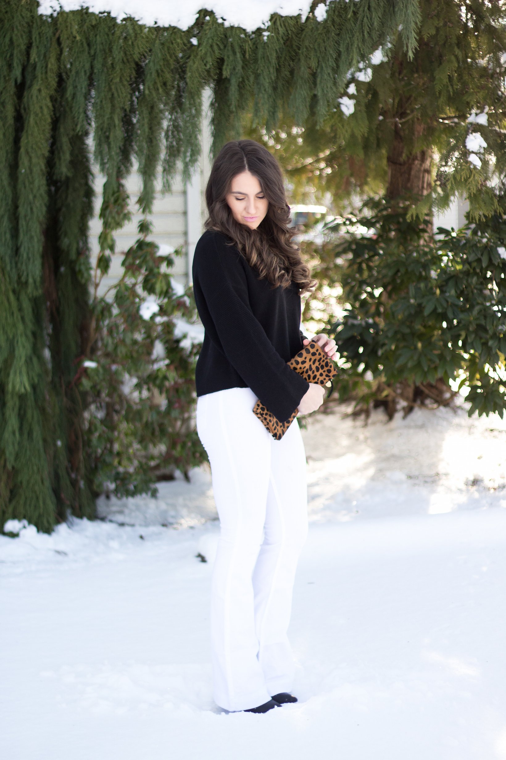 Winter white flares with black flared sleeve sweater for styling flares with confidence.