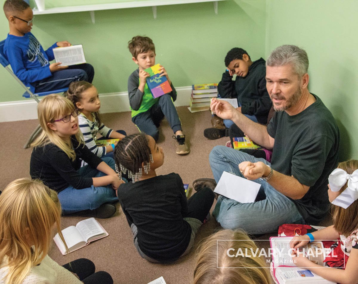 Sunday school teacher tells Bible story to kids