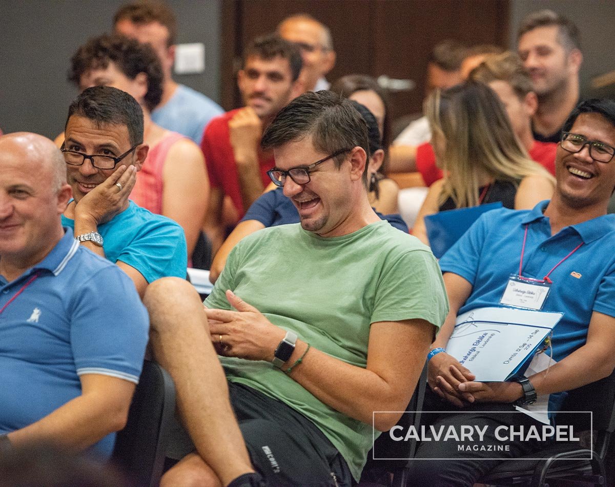 Men laughing at conference