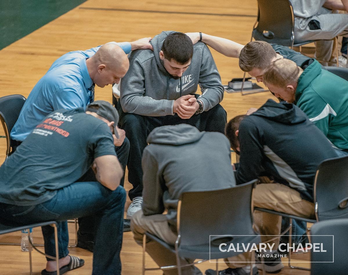 group of men prays