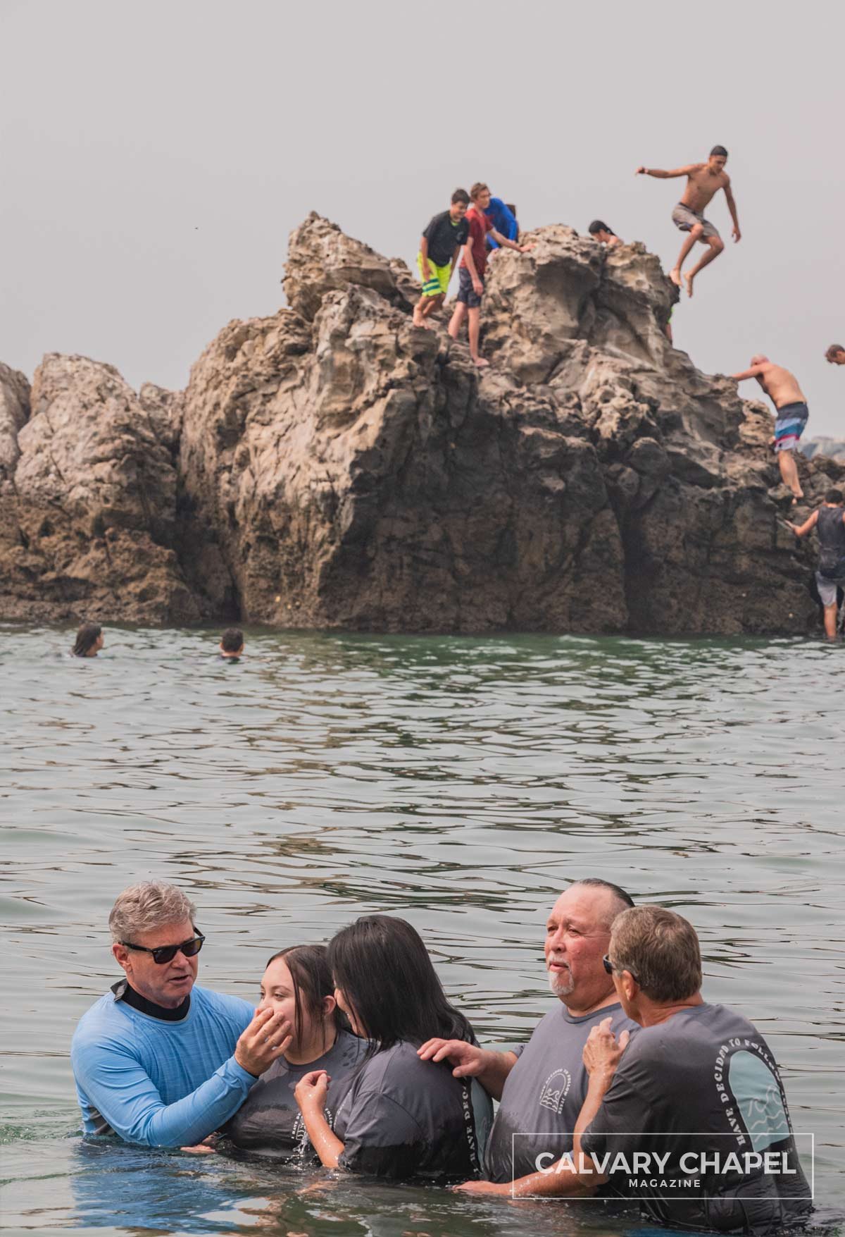 Pastor Jack baptizing people and kids jumping off rocks