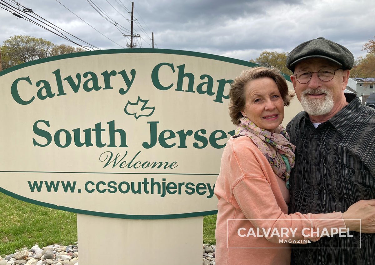Harry and Irma Pressley standing by the CCSJ sign