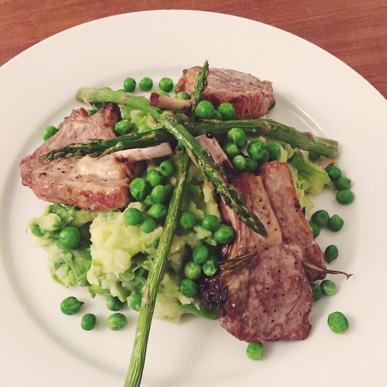Roast lamb with pea and asparagus mash