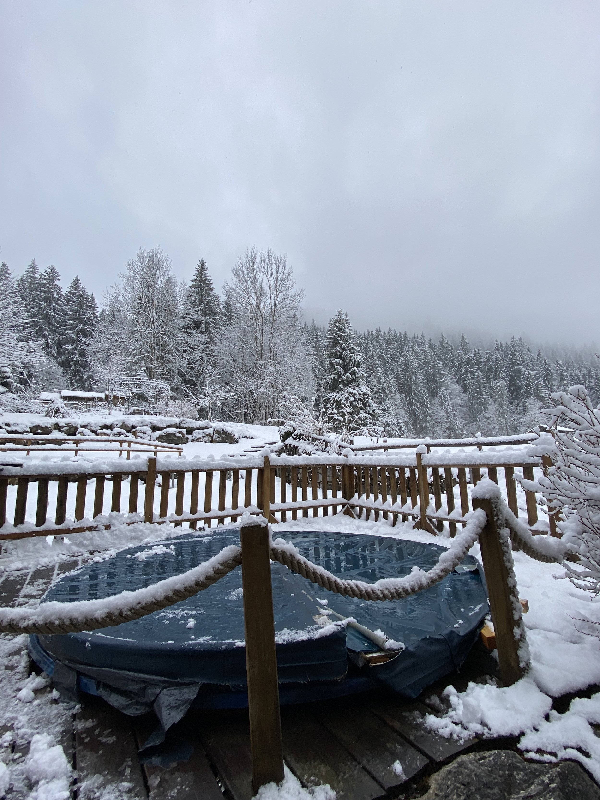 The jacuzzi in the snow outside the dining room of Chilly Powder