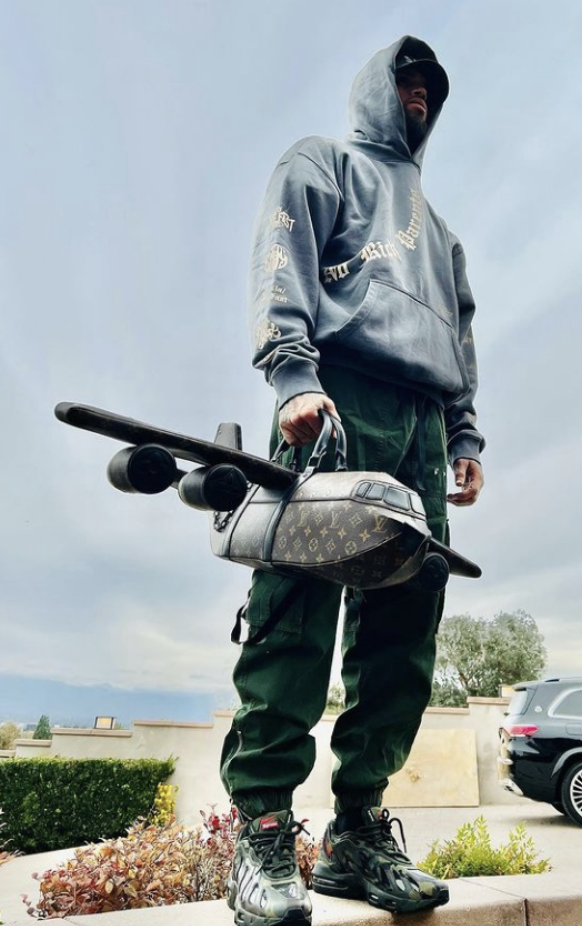 Louis Vuitton airplane bag worn by Chris Brown 
