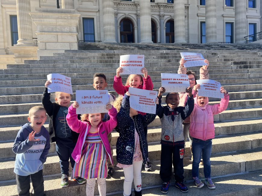 ELC Preschoolers hold up rally signs in support of early childhood investments on the steps of the Kansas statehouse