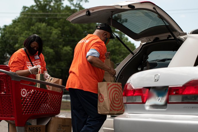 Volunteers load up car with food and supplies at YWCA Midtown