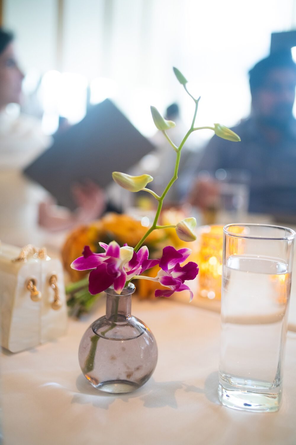 Table orchids. NYC Bangledesh wedding NYC City Hall shot by documentary style wedding photographer Angela Cappetta.