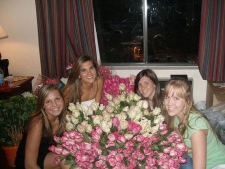Kristi Landphere's daughters and niece posing with flowers she designed for her niece’s wedding
